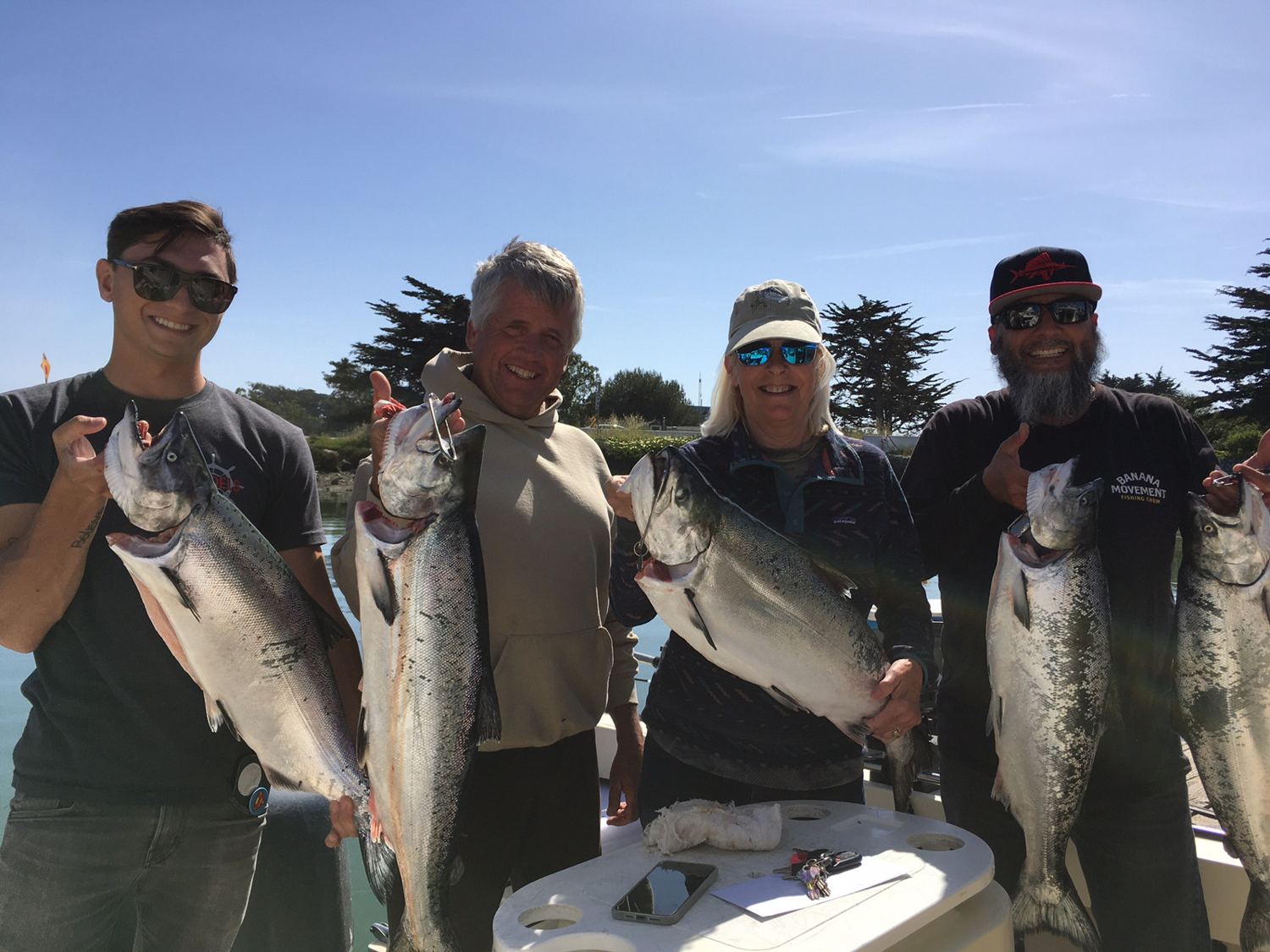 Group with salmon at the dock