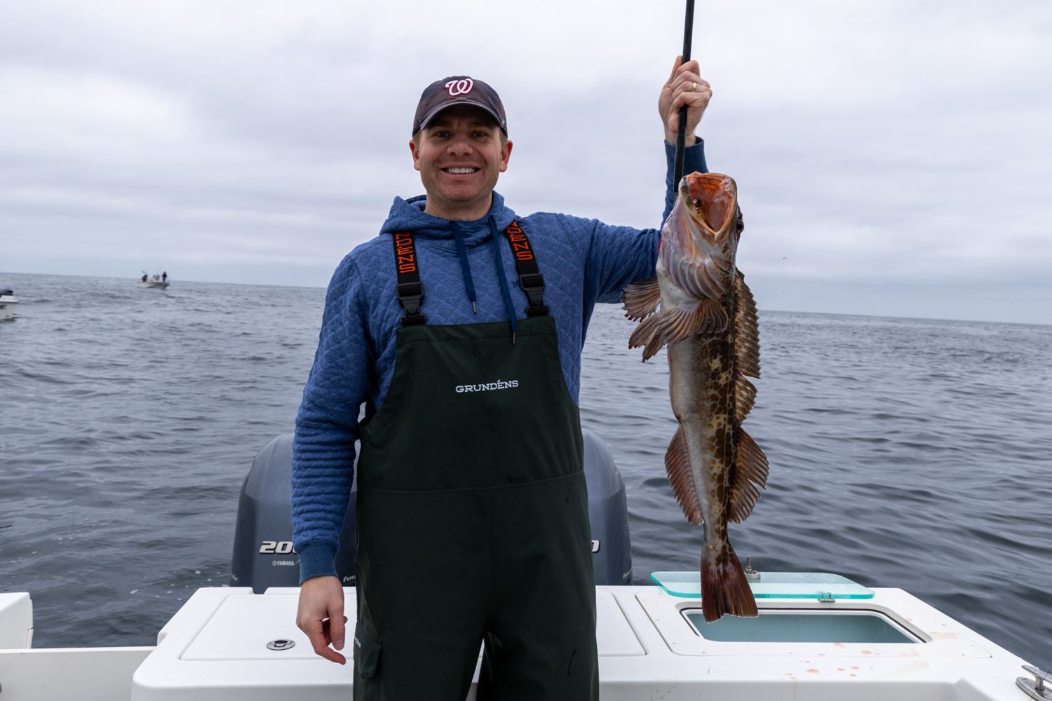 Captain with a lingcod